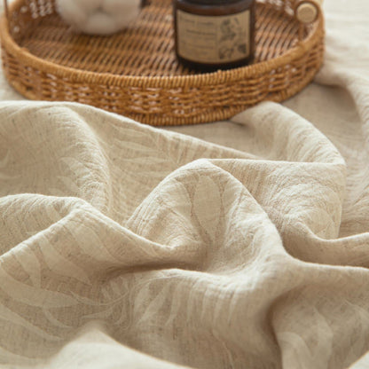 Couvre-lit beige en coton et lin à motif botanique