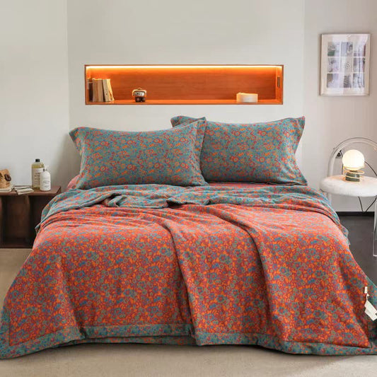 Couette jacquard orange en gaze de coton à motif floral