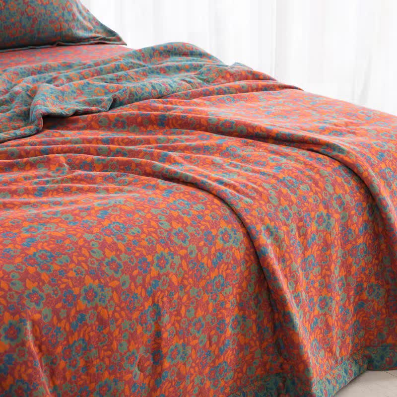 Couette jacquard orange en gaze de coton à motif floral