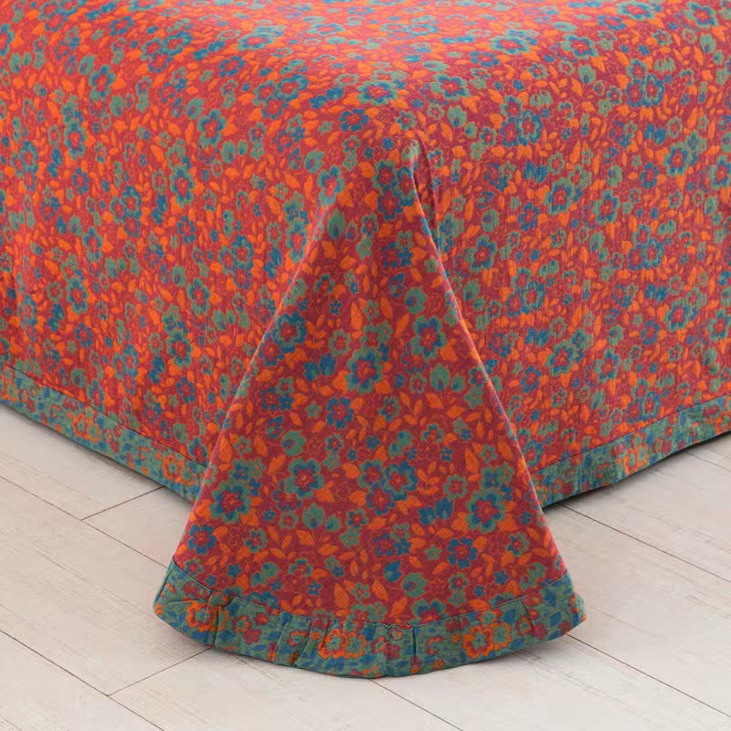 Couette jacquard orange en gaze de coton à motif floral