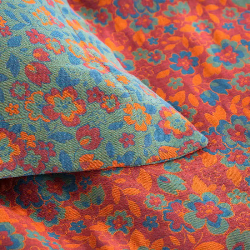 Couette jacquard orange en gaze de coton à motif floral