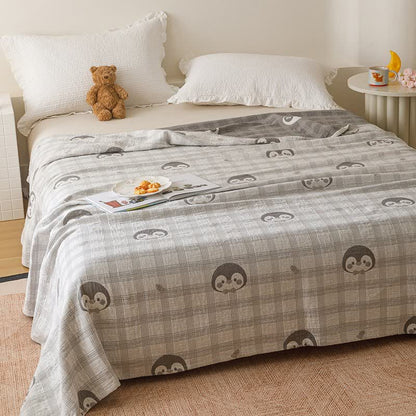 courtepointe en gaze de coton à carreaux et à motifs de pingouins - image 1
