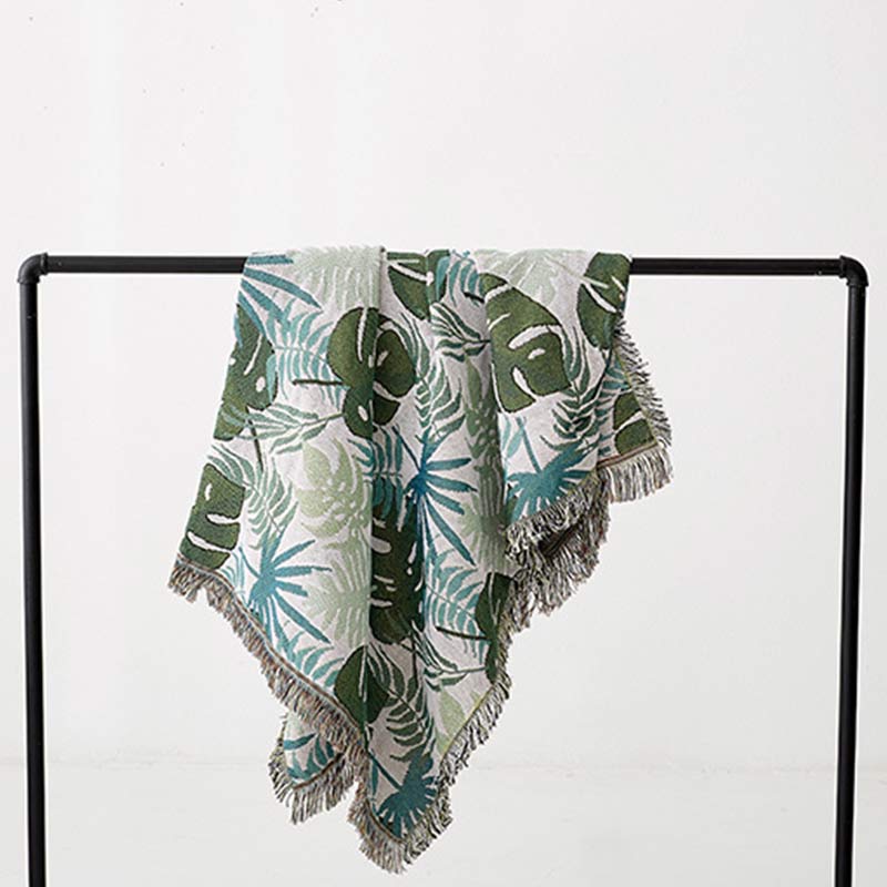 Housse de canapé avec motif palmier et couverture à pompons