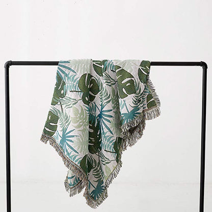 Housse de canapé avec motif palmier et couverture à pompons
