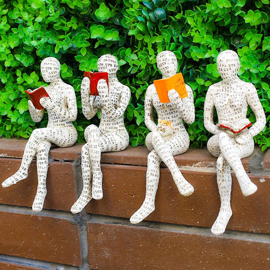 Statue d'un penseur en train de lire, servant de décoration pour une bibliothèque - image 0