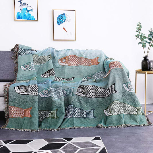 Couverture réversible avec pompons et imprimé koi