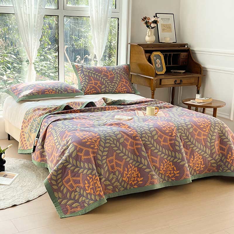 Couette réversible en coton avec des feuilles vertes et oranges