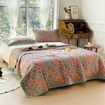 Couette réversible en coton avec des feuilles vertes et oranges