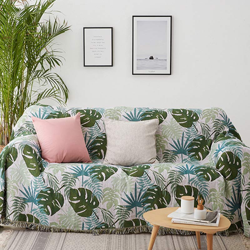 Housse de canapé avec motif palmier et couverture à pompons