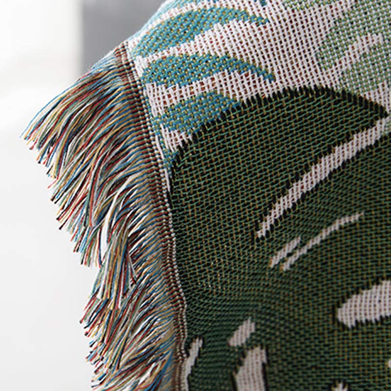 Housse de canapé avec motif palmier et couverture à pompons