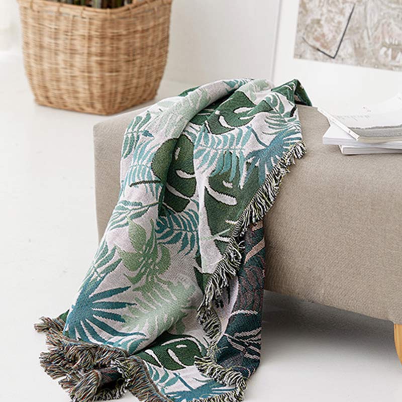 Housse de canapé avec motif palmier et couverture à pompons