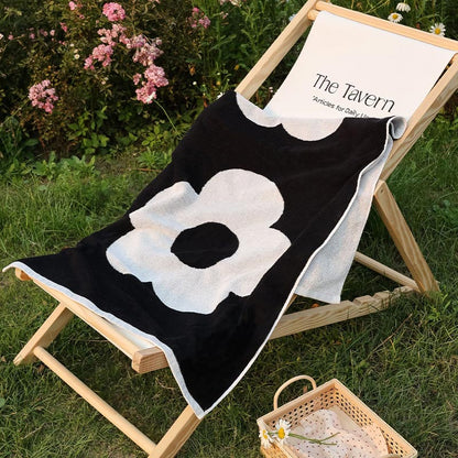 Serviette en coton doux et respirant avec motif floral