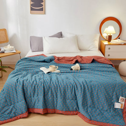 Couverture douce et réversible en pur coton avec un motif quadrillé