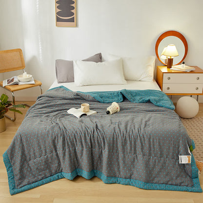 Couverture douce et réversible en pur coton avec un motif quadrillé