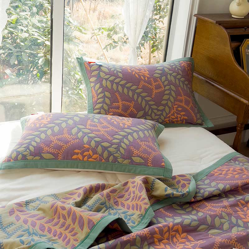 Couette réversible en coton avec des feuilles vertes et oranges