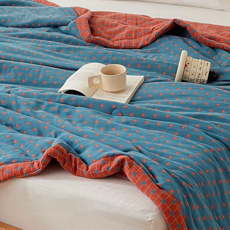 Couverture douce et réversible en pur coton avec un motif quadrillé