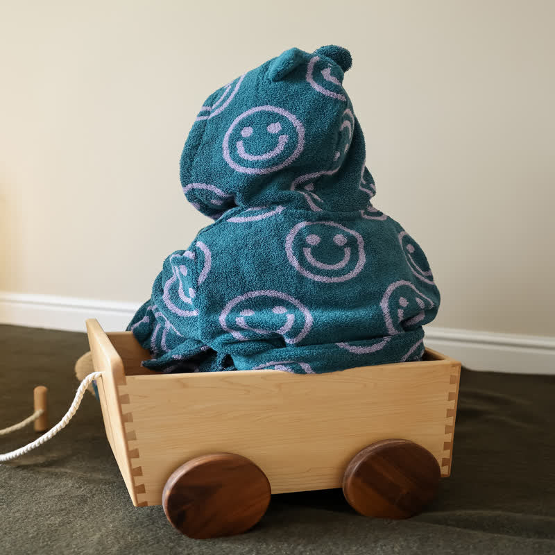 Peignoir en coton avec capuche et visage souriant