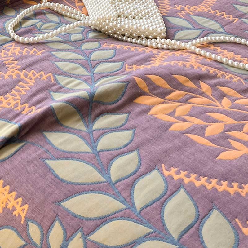 Couette réversible en coton avec des feuilles vertes et oranges