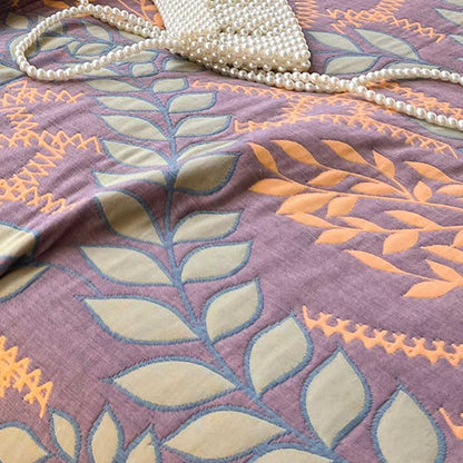 Couette réversible en coton avec des feuilles vertes et oranges