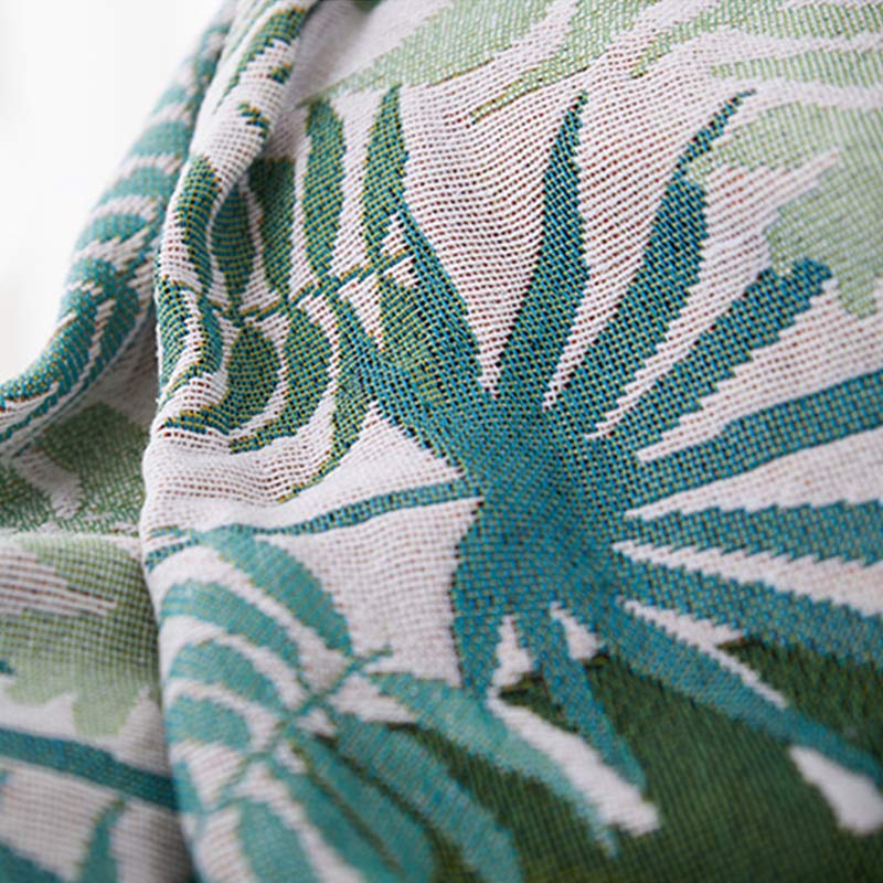 Housse de canapé avec motif palmier et couverture à pompons
