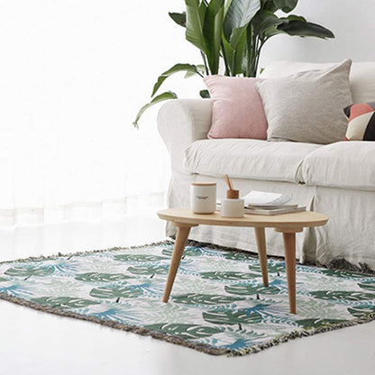 Housse de canapé avec motif palmier et couverture à pompons