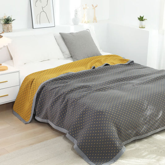 Couverture douce et réversible en pur coton avec un motif quadrillé