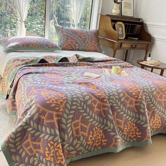 Couette réversible en coton avec des feuilles vertes et oranges