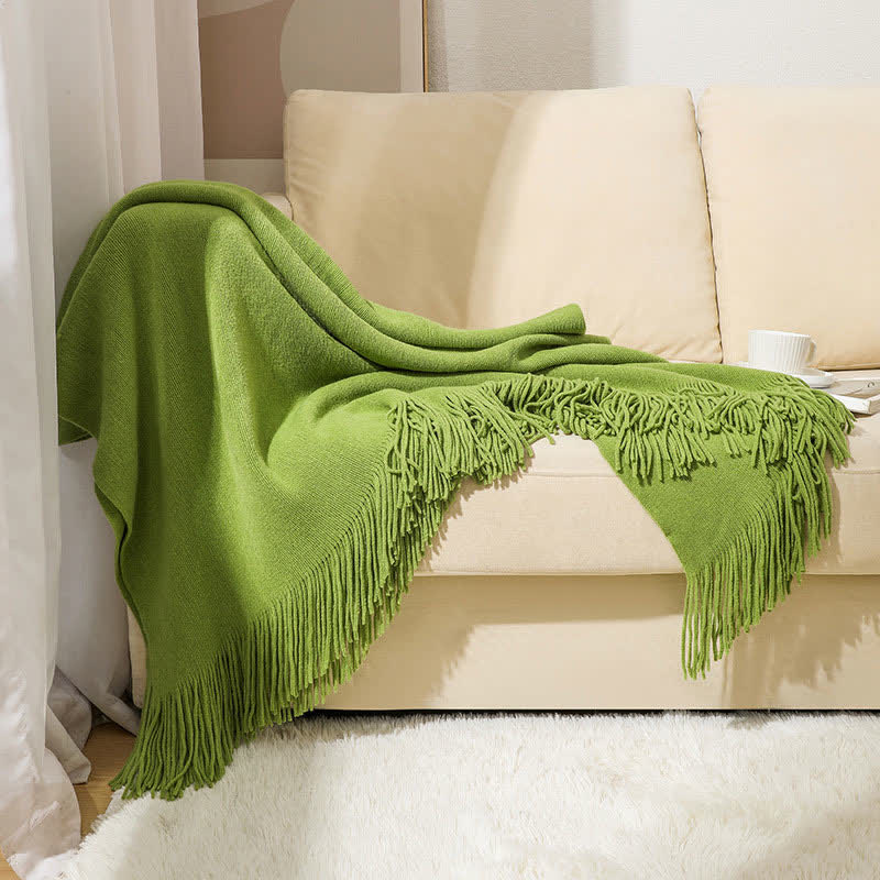 Couverture simple et unie avec des pompons