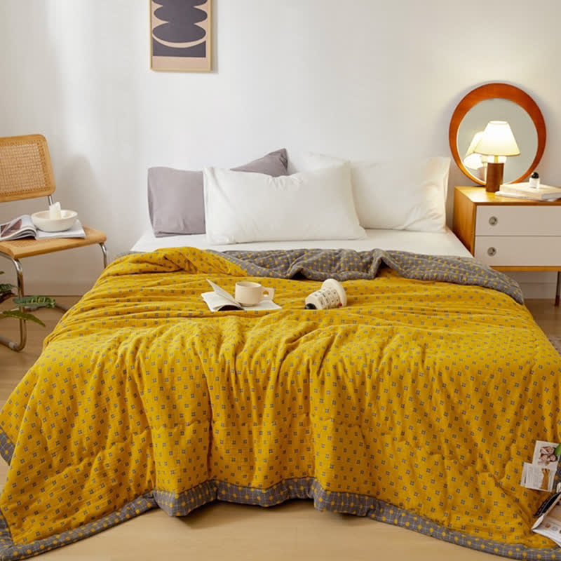 Couverture douce et réversible en pur coton avec un motif quadrillé