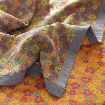 Couette réversible en gaze de coton à motif floral et jacquard