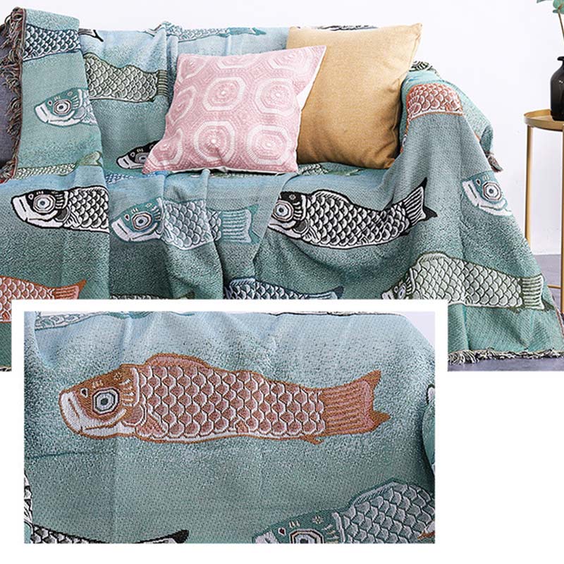 Couverture réversible avec pompons et imprimé koi