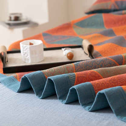 Couette réversible en coton à motif triangulaire
