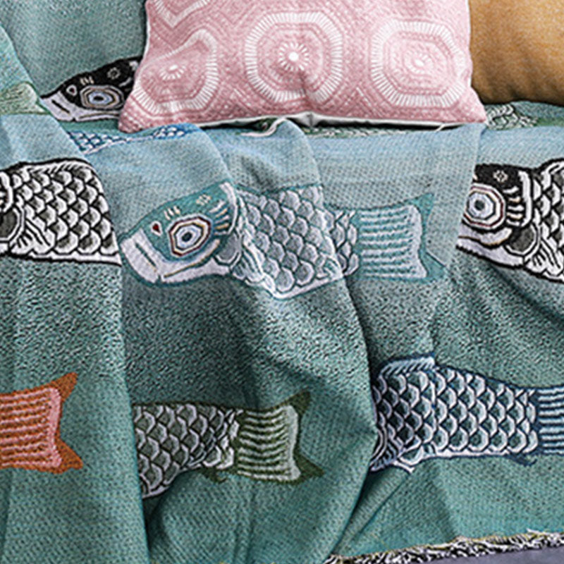 Couverture réversible avec pompons et imprimé koi