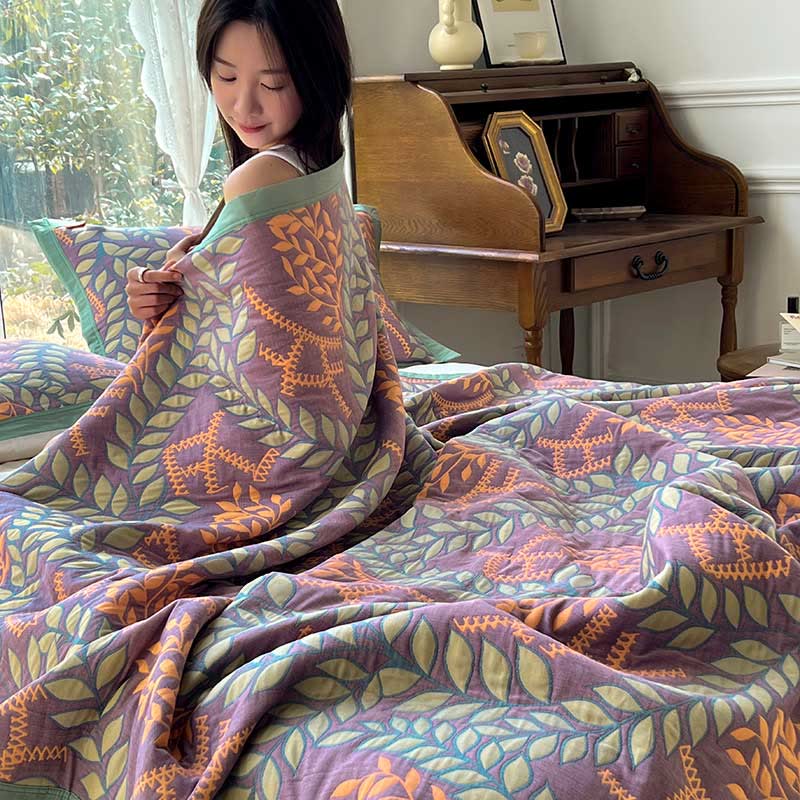 Couette réversible en coton avec des feuilles vertes et oranges