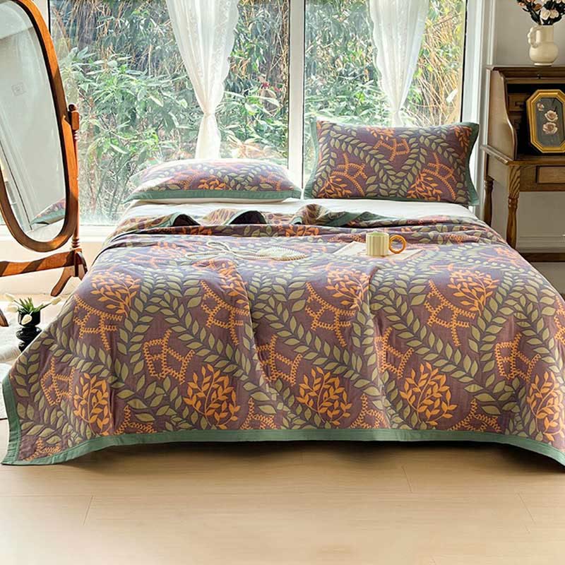 Couette réversible en coton avec des feuilles vertes et oranges