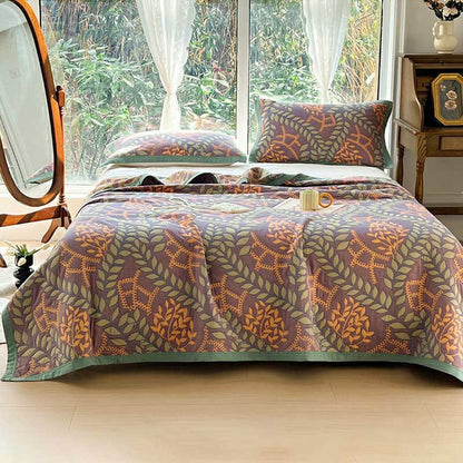 Couette réversible en coton avec des feuilles vertes et oranges