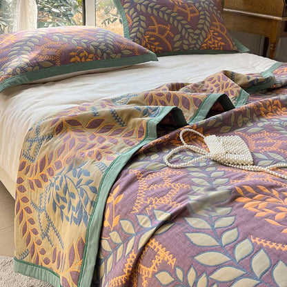 Couette réversible en coton avec des feuilles vertes et oranges