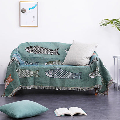 Couverture réversible avec pompons et imprimé koi