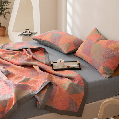 Couette réversible en coton à motif triangulaire